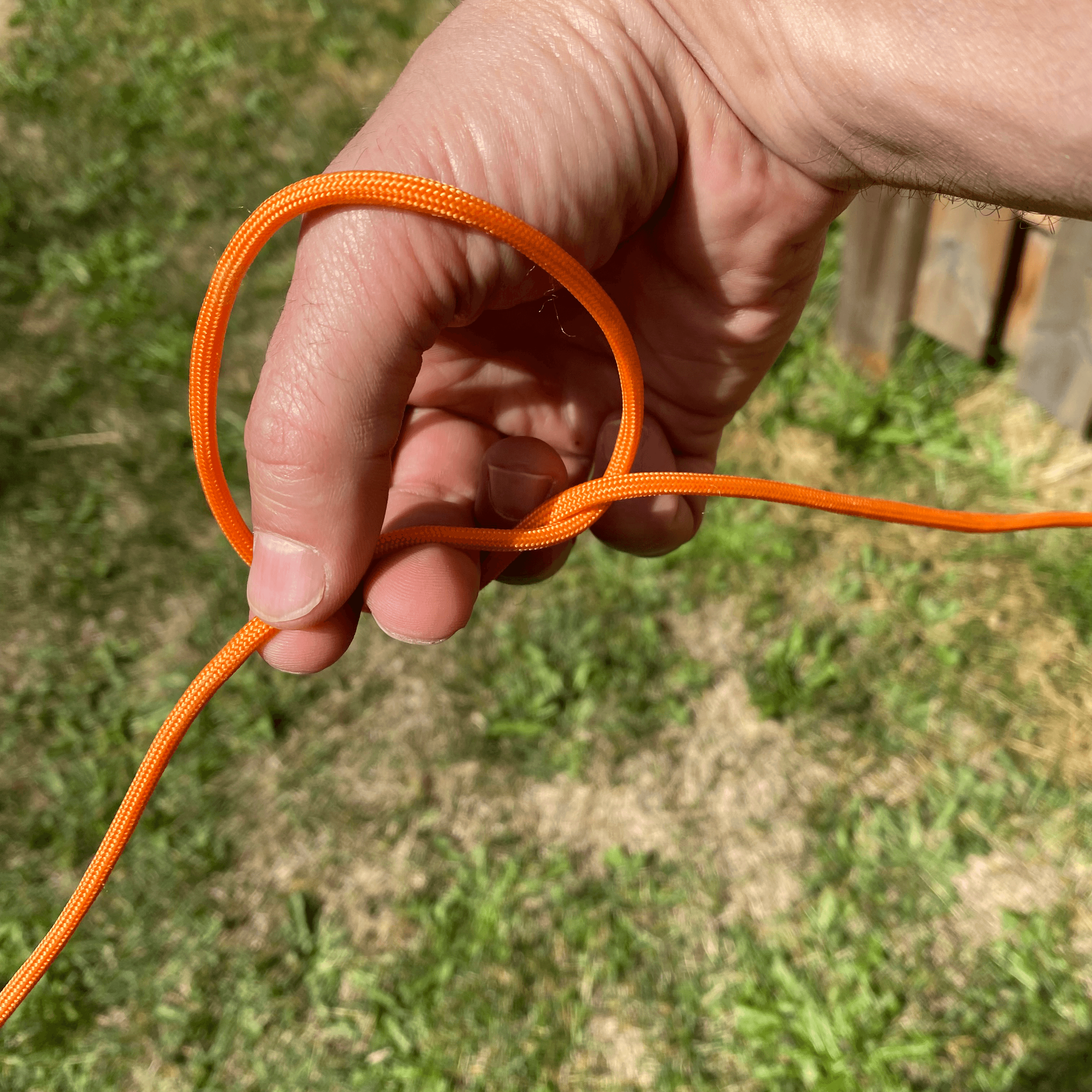 make a claw and grab a bight of the working line through the loop